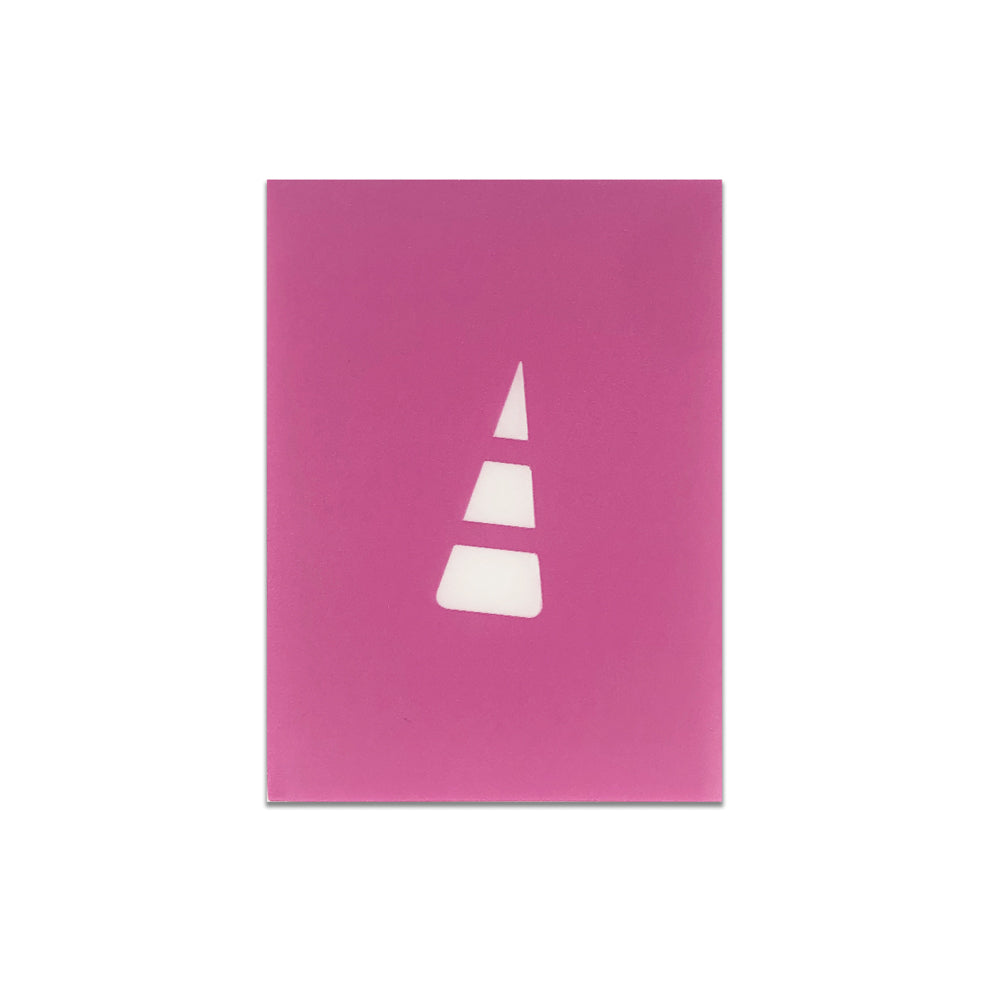 A pink card with a white cut-out of a geometric tree shape, protected by Unstable Games: Purple Card Sleeves, is centered on it.