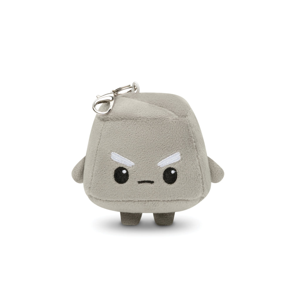 Introducing the Cobble Plushie Charm Keychain from Unstable Games - a small, gray plush toy featuring two short legs, small arms, and a convenient keychain attachment. The character showcases a frowning face adorned with white eyebrows and black eyes.