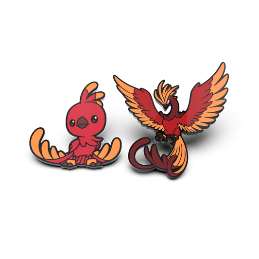 The Ashe Firecrest & Ashe the Inferno Enamel Pin Set by Unstable Games includes two vibrant, cartoon-style pins depicting Ashe Firecrest from the Casting Shadows characters. One pin showcases wings down, while the other features wings spread wide.
