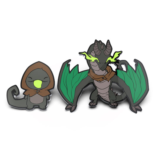 Two Haze Greentongue & Haze the Devastator enamel pin set: one is a small, hooded figure with a glowing green orb, and the other a larger dragon named Haze Greentongue with green wings and horns. Brand Name: Unstable Games