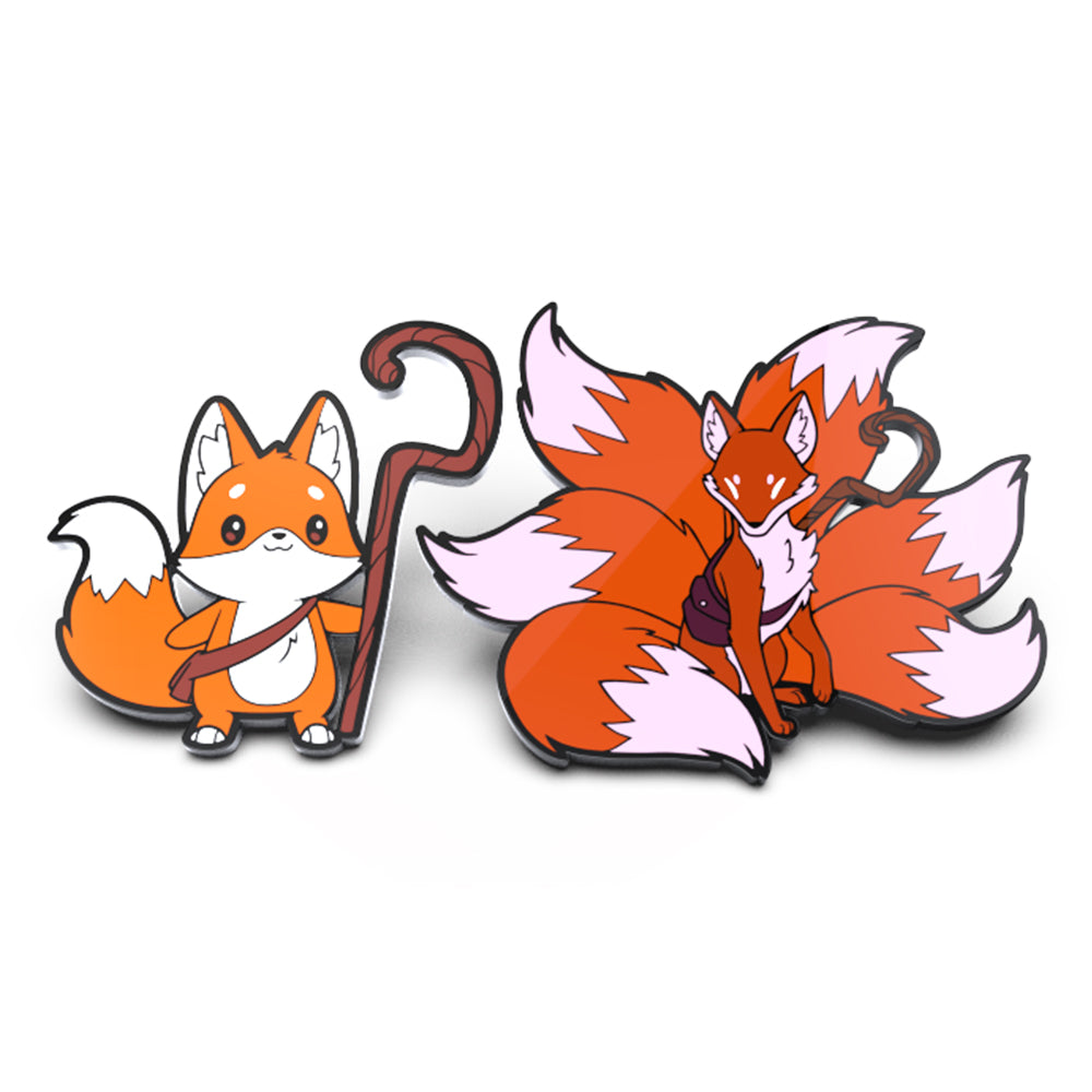 Two enamel pins depicting stylized foxes, one standing with a walking stick and the other sitting with tails spread out, against a white background. These include the Kit Gale & Kit the Turbulent Enamel Pin Set from Unstable Games.