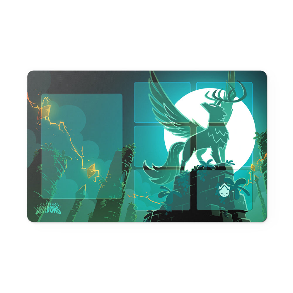 Illustrated laptop skin featuring Casting Shadows: The Ice Storm Expansion Play Mat Set by Unstable Games, featuring a mythical creature in a dynamic, green-toned design with abstract elements and the text "shadows" on the play mat at the bottom left.