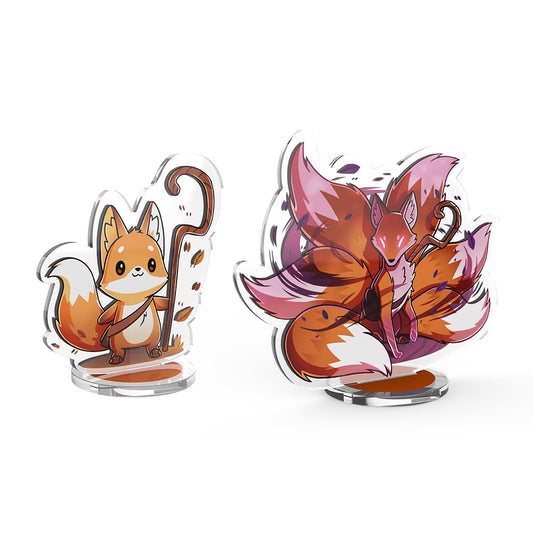 Two Casting Shadows: Kit Gale & Kit the Turbulent acrylic standees of an anthropomorphic fox with a large, bushy tail, one calm and one in a dynamic, fiery pose, casting shadows on a white background by Unstable Games.