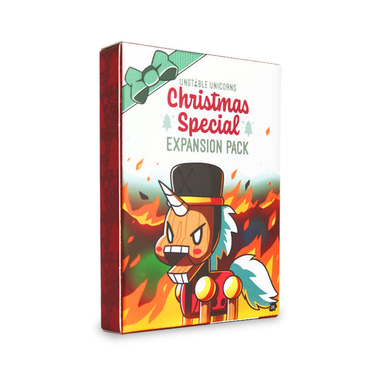 Unstable Games' Unstable Unicorns: Christmas Expansion game box featuring a cartoon unicorn with an angry expression amid flames.