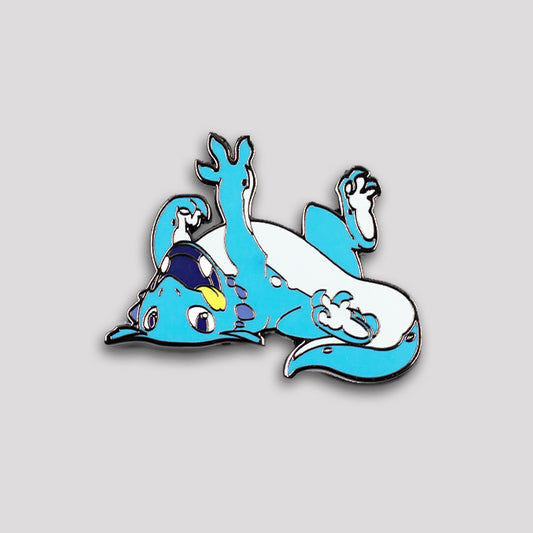 Enamel pin depicting the Friendly Dragon Pin from Unstable Games, a friendly blue dragon lying on its back, playfully waving its arms and legs, with a happy expression.
