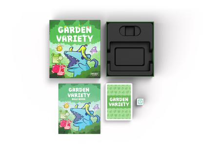 A game box with "Garden Variety: Base Game" from Unstable Games written on it, alongside a rule book, a deck of cards, and an empty insert tray inside the box. The box and book feature colorful, cartoonish garden-themed illustrations.