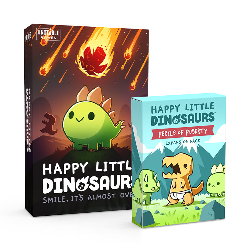 Two board game boxes, "Happy Little Dinosaurs" with a cute green dinosaur under a falling meteor, and its expansion pack "Perils of Puberty" featuring three dinosaurs.
