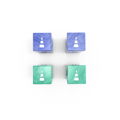 Four Here to Slay: Warriors & Druids Dice Sets arranged in a square pattern on a white background; two blue on top and two green at the bottom, accompanied by various dice sets.