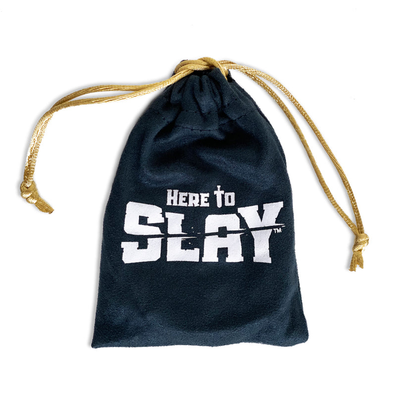 A navy blue drawstring bag with the Unstable Games Here to Slay: 6-Class Dice Set printed in white block letters, isolated on a white background.