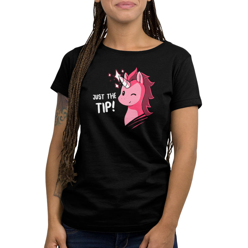 Woman wearing a black ringspun cotton tee with a pink unicorn design and the product "Just The Tip (UU)" by Unstable Games.