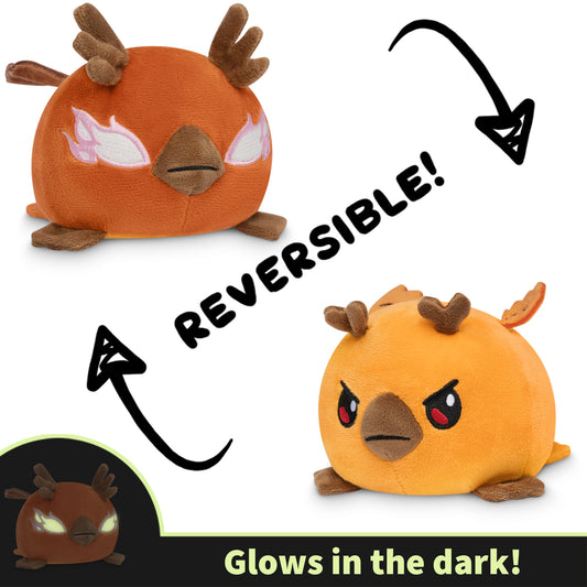 Reversible plushie shown in two states: a happy Talon Lightfeather and an angry Talon the Dark Storm, with a feature that it glows in the dark indicated.