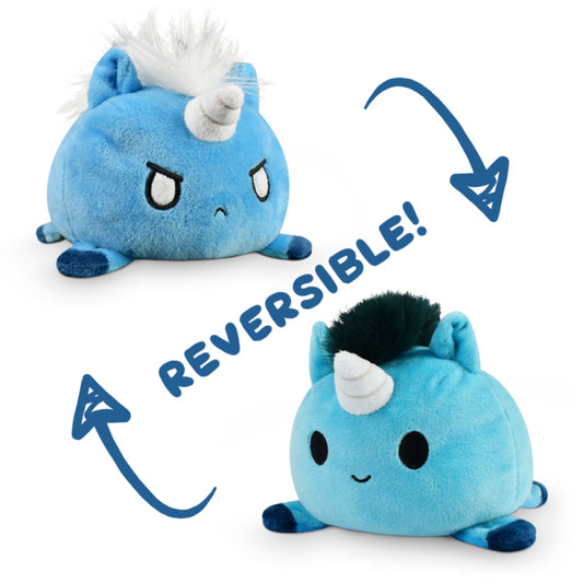 Reversible Tic Tac K.O. Dragons vs. Unicorns: Angry & Tiny Hooves plushies, displaying two expressions: one side shows a grumpy face, the other a happy face, with arrows indicating the toy can be flipped. By Unstable Games.