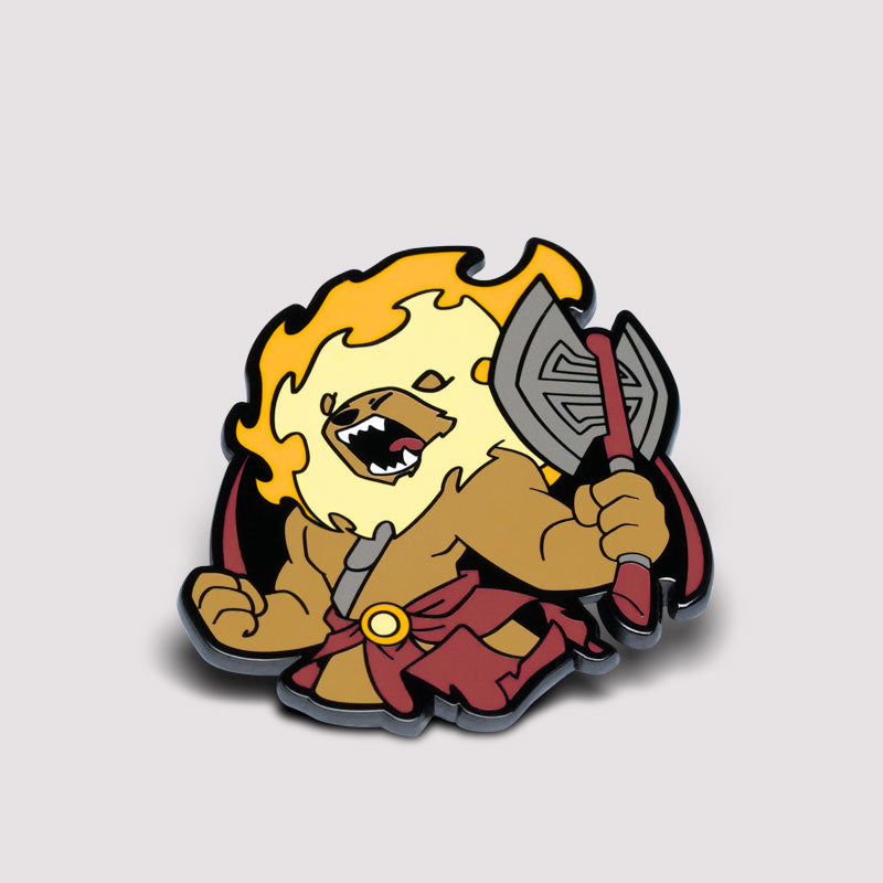Sticker of a cartoon lion with a fiery mane, wearing a red cape and holding an axe, in a fierce pose, titled "Here to Slay" featuring the Raging Manticore Pin by Unstable Games.