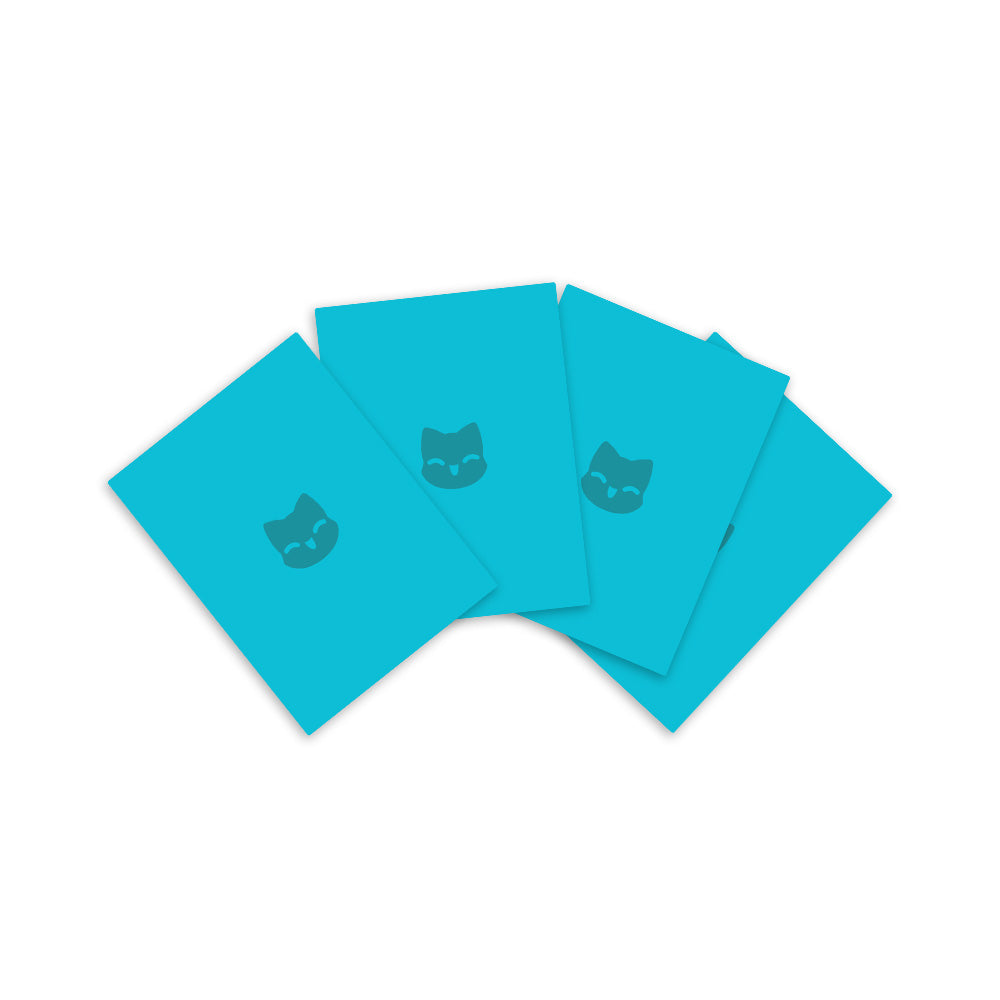 Five teal Unstable Games Tic Tac K.O. Cute vs. Evil: Team Cute card sleeves with a cat face icon displayed in a fanned-out arrangement on a white background.