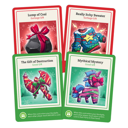 Four humorous gift-themed trading cards, each illustrated with holiday artwork and color-coded, featuring a lump of coal, an itchy sweater, a candy cane, and a mythological creature from the Here to Slay: Here to Sleigh Expansion by Unstable Games.