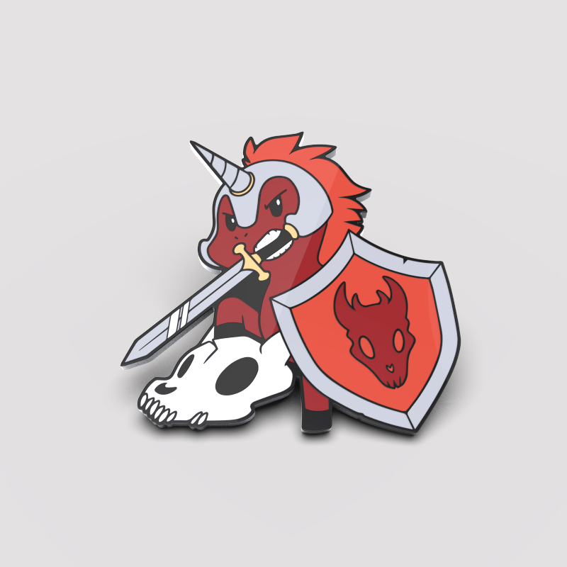 Illustration of a red Dragon Slayer Unicorn Pin with a unicorn horn, wielding a sword and shield adorned with a dragon emblem, standing over a skull by Unstable Games.