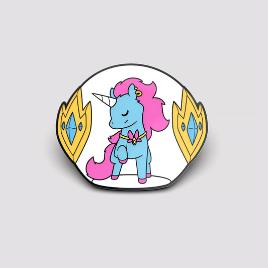 A Vibrant Glow Pin of a blue unicorn with pink hair and a golden horn, set inside a stylized oval enamel pin frame with yellow crests by Unstable Games.