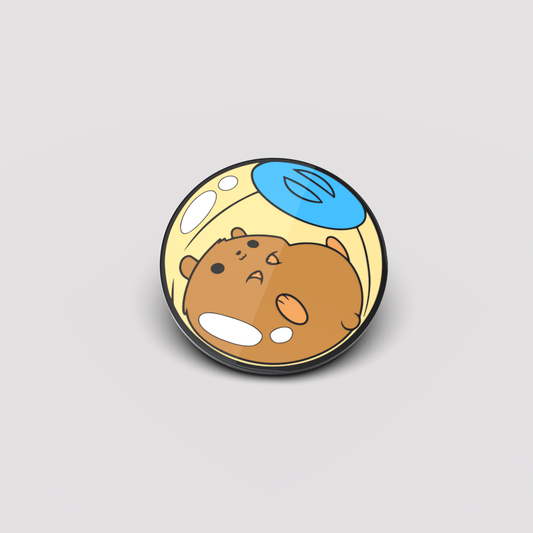Illustration of Mr. Fuzzums, The Hamster Pin, a cute brown hamster inside a clear bubble, floating against a plain gray background. Brand Name: Unstable Games