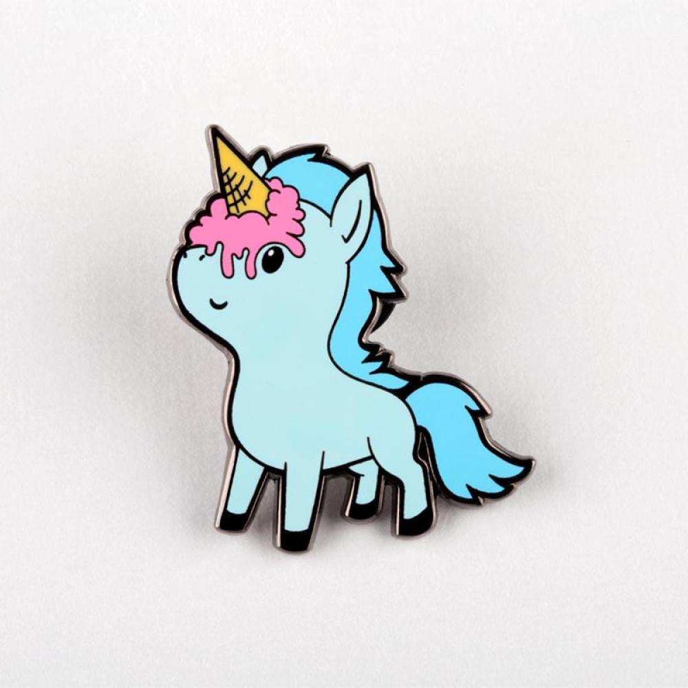 An Ice Cream Unicorn Pin from Unstable Games with a pink mane and a yellow horn, set against a plain white background.