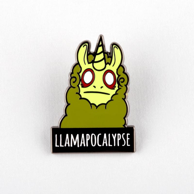Enamel pin depicting a green llama with red eyes and horns above a “Llamapocalypse Pin” label on a white background by Unstable Games.